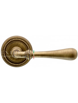 Дверная ручка Extreza "EVA" (Эва) 319 на розетке R03 матовая бронза F03