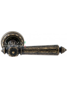 Дверная ручка Extreza "LEON" (Леон) 303 на розетке R02 античная бронза F23